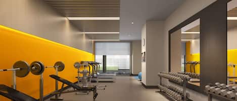 Ein modernes Fitnessstudio mit Kraftgeräten, Laufbändern und Kurzhanteln.