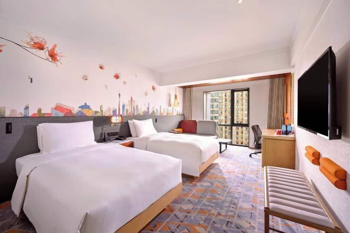Premium bedding, down duvets, memory-foam beds, in-room safe