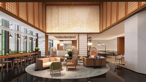 A spacious lobby with a high ceiling, modern furniture, and a central seating area. - Hilton Garden Inn Guangzhou Tianhe (Guangzhou)