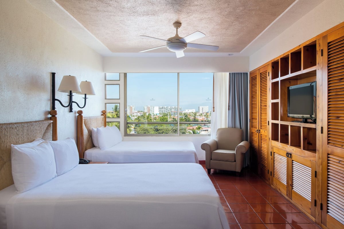 studio, 2 double beds, garden view | 2 bedrooms, in-room safe, iron/ironing board, free cots/infant beds