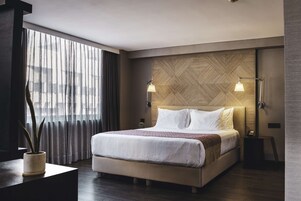 Premium bedding, down comforters, pillowtop beds, in-room safe