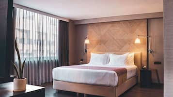 Premium bedding, down comforters, pillowtop beds, in-room safe