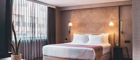 Premium bedding, down comforters, pillowtop beds, in-room safe