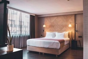 Premium bedding, down comforters, pillowtop beds, in-room safe