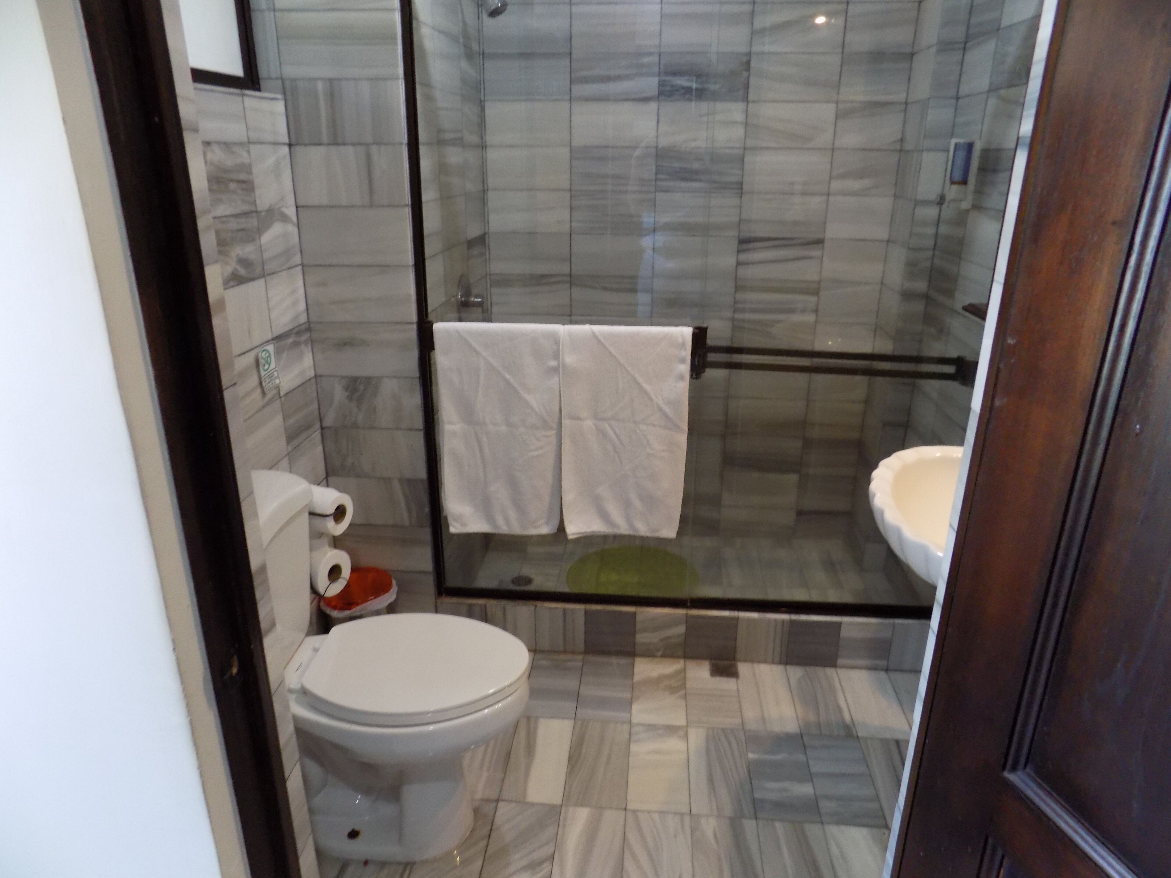 premium triple room | bathroom | rainfall showerhead, hair dryer, towels, soap