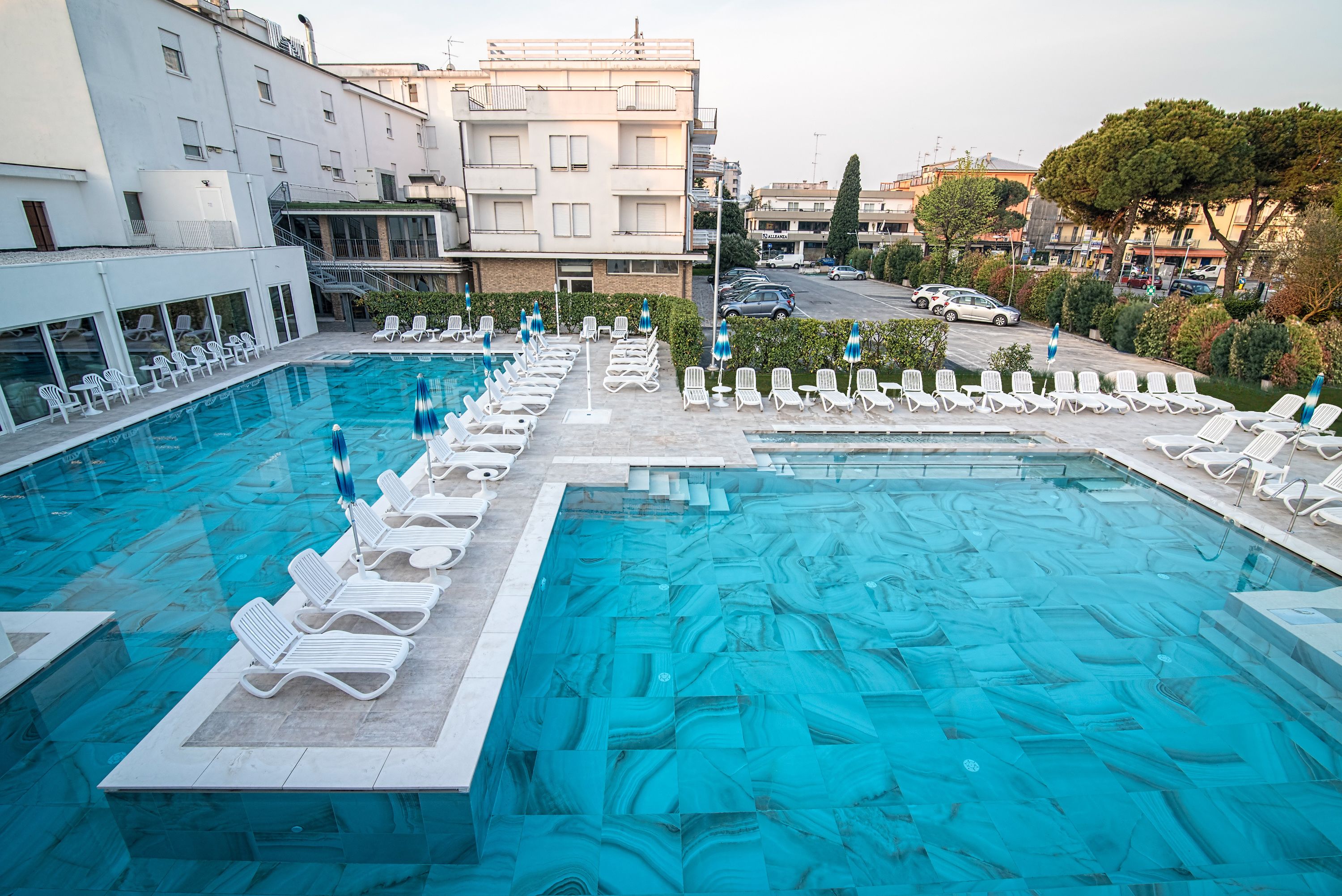 indoor pool, seasonal outdoor pool, pool umbrellas, pool loungers