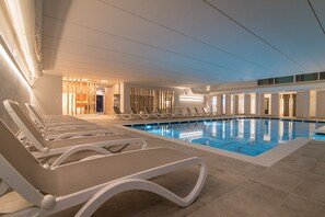 Indoor pool, seasonal outdoor pool, pool umbrellas, sun loungers