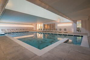 Indoor pool, seasonal outdoor pool, pool umbrellas, pool loungers