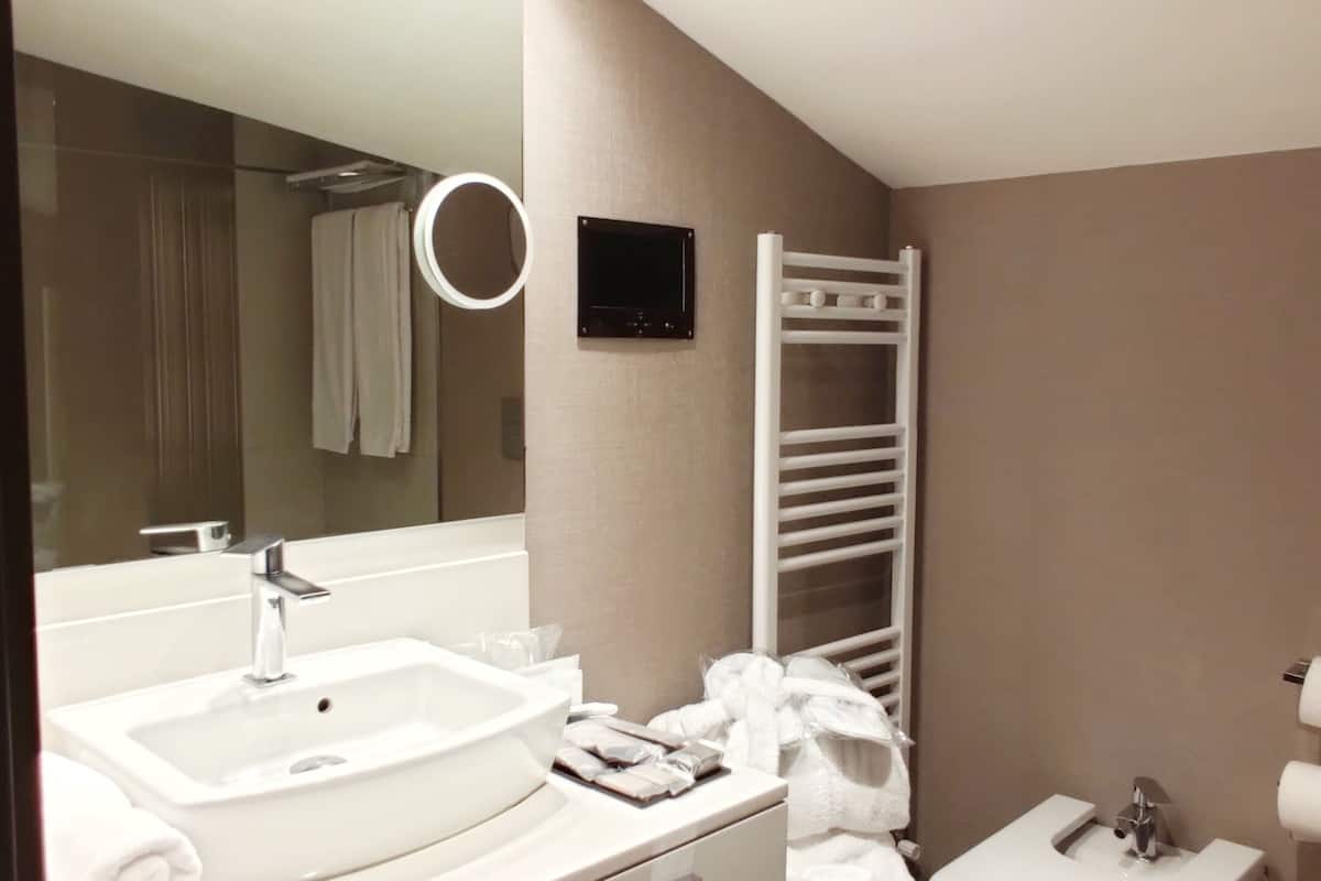 junior suite | bathroom | rainfall showerhead, free toiletries, hair dryer, bathrobes