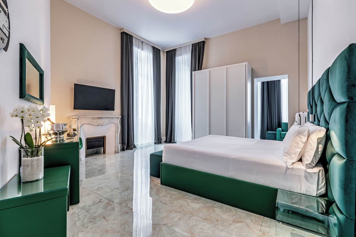 Suite junior | Ropa de cama de alta calidad, colchones con acolchado adicional, minibar