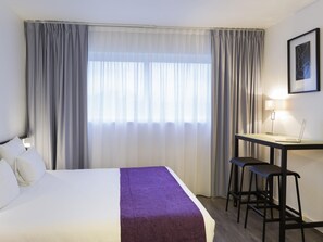Roba de llit d'alta qualitat, minibar i caixa forta a l'habitació 