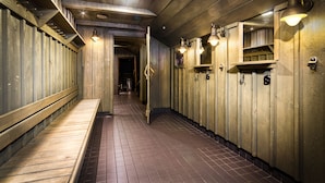 A narrow hallway with wooden walls and benches on one side. - Eurohostel (Helsinki)