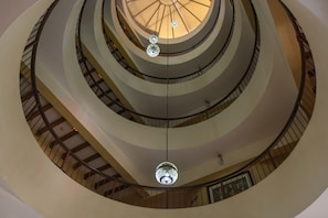 A multi-level atrium with a central open space and a circular skylight. - New Farah Hotel (Agadir)