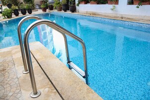 Outdoor pool, pool umbrellas, sun loungers