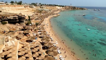 Private beach, free beach shuttle, sun loungers, beach umbrellas