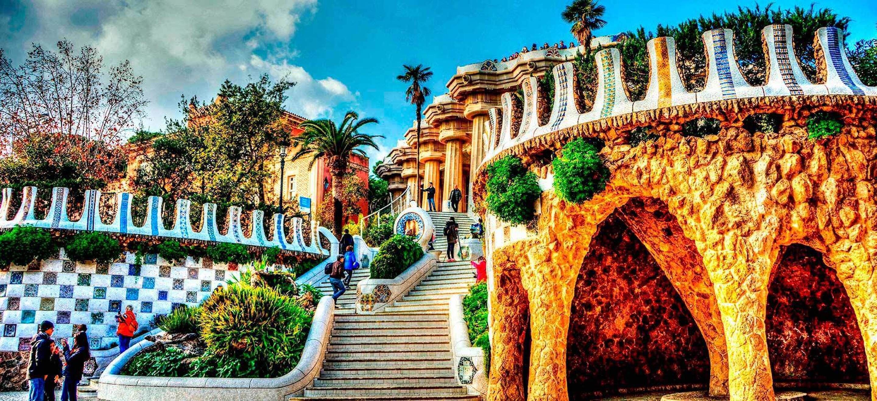 A staircase leading to a building with ornate arches and a decorative railing.