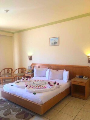 Premium bedding, down duvets, in-room safe, desk