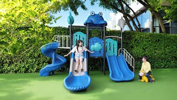 A playground with slides and climbing structures.