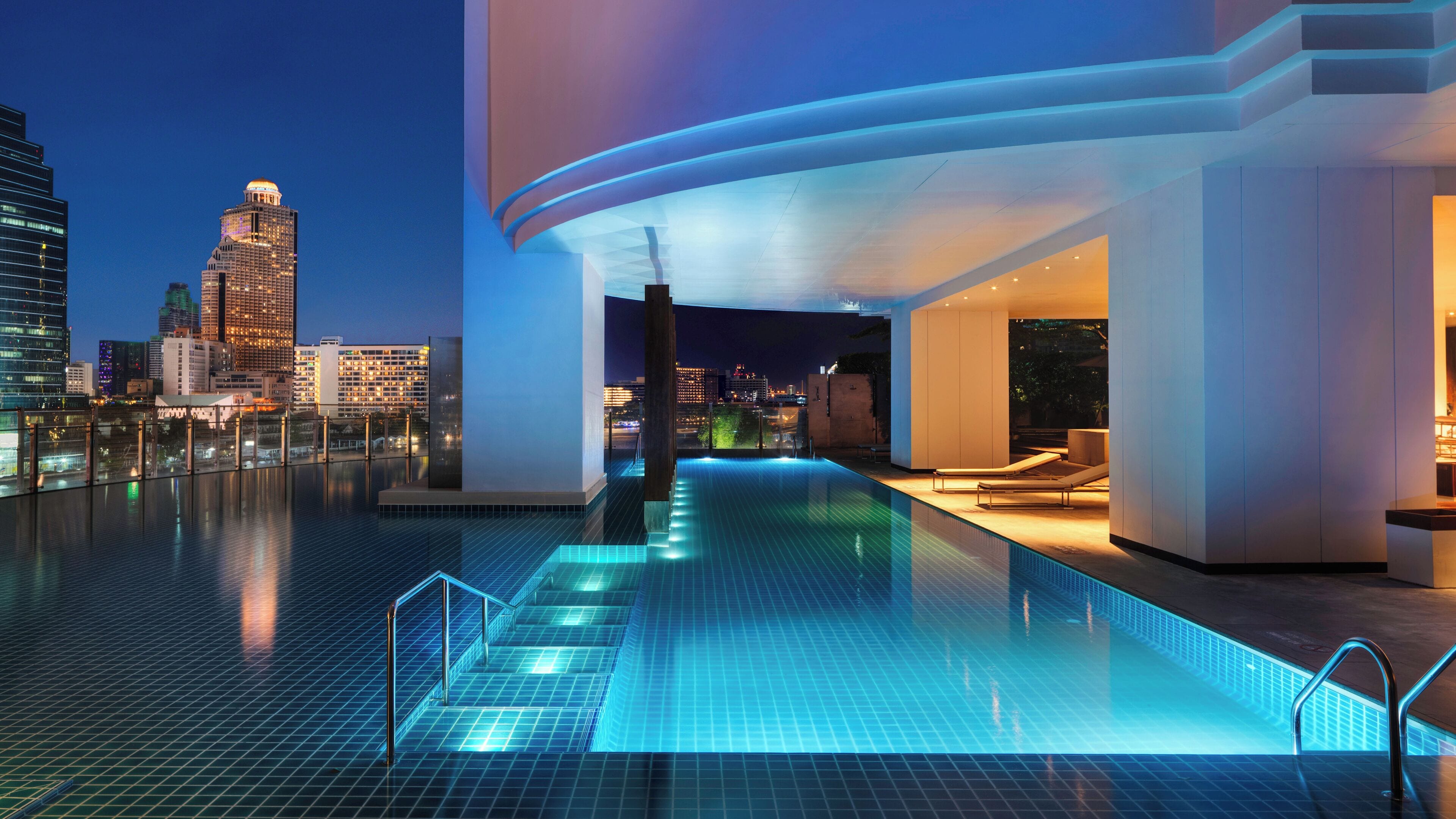 outdoor pool, pool umbrellas, pool loungers