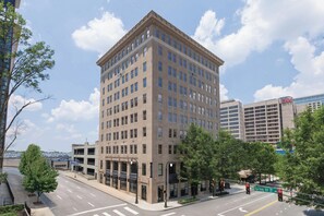 A multi-story building with a classic architectural design, featuring a central entrance and multiple windows. - Glenn Hotel, Autograph Collection (Atlanta)