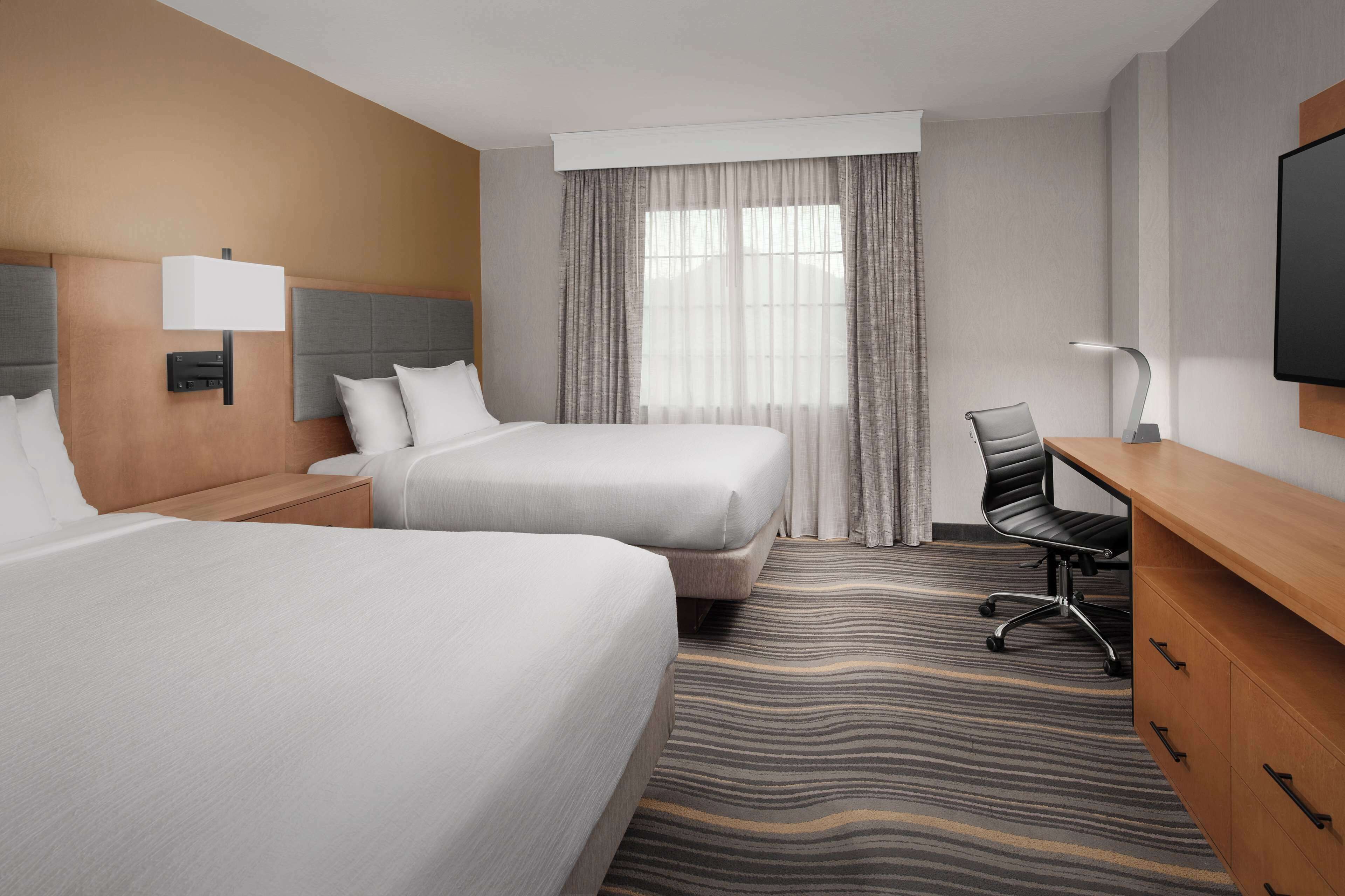 standard suite, 2 queen beds | premium bedding, in-room safe, iron/ironing board, free cots/infant beds