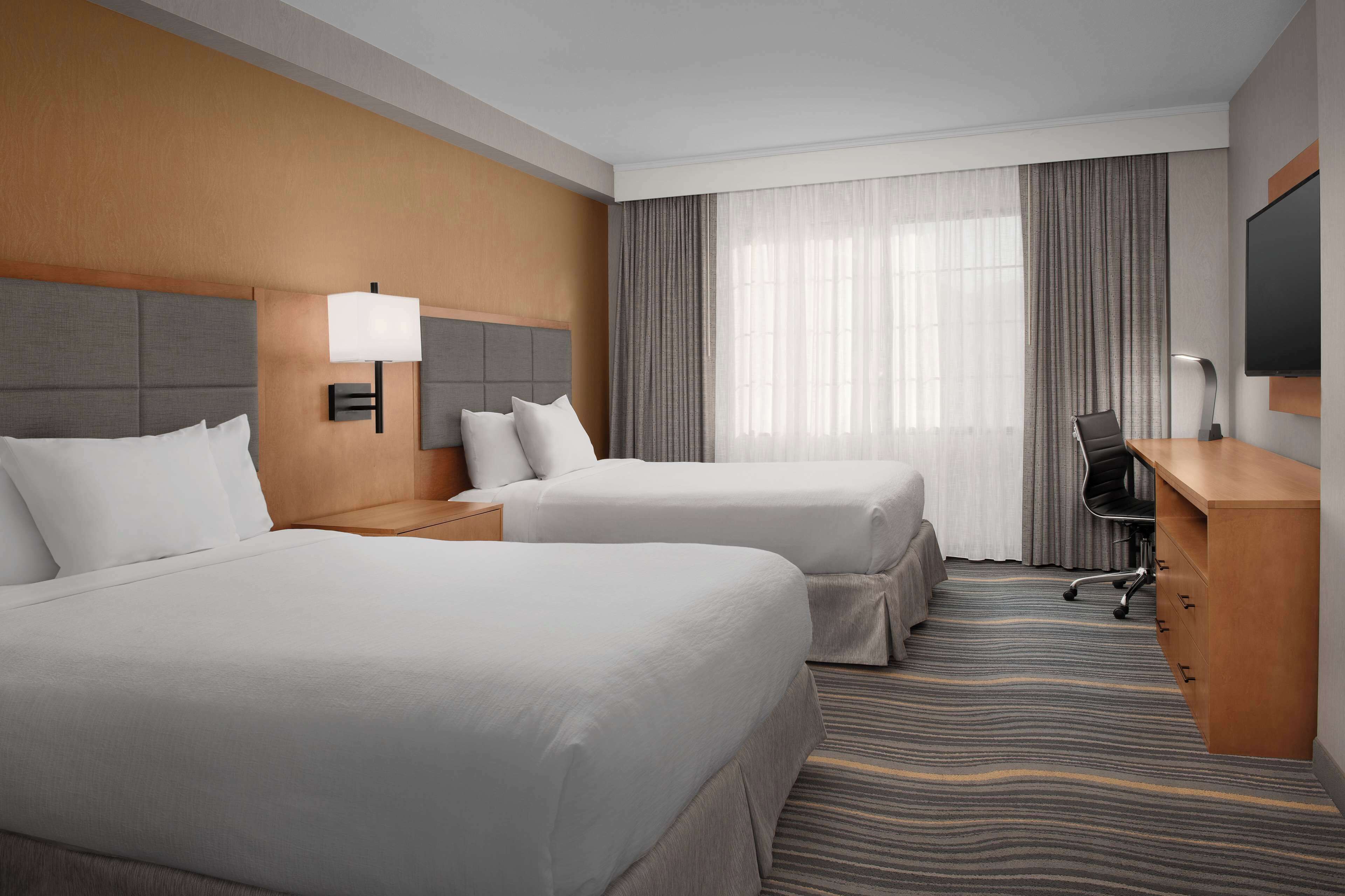 suite, 2 queen beds, accessible, non smoking | premium bedding, in-room safe, iron/ironing board, free cots/infant beds