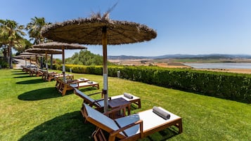 Seasonal outdoor pool, pool umbrellas, pool loungers