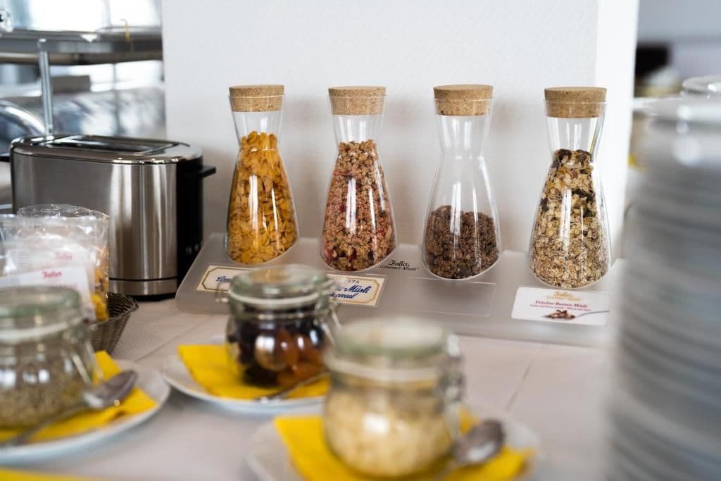 A kitchen counter with various food items and containers.