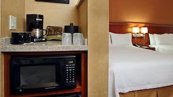 A hotel room with a kitchenette area including a microwave, coffee maker, and tea kettle.