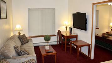 Suite, 1 Queen Bed | Living room | Flat-screen TV