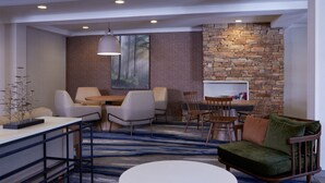 A modern interior with a stone accent wall, a dining area, and a seating area with a sofa and chairs.