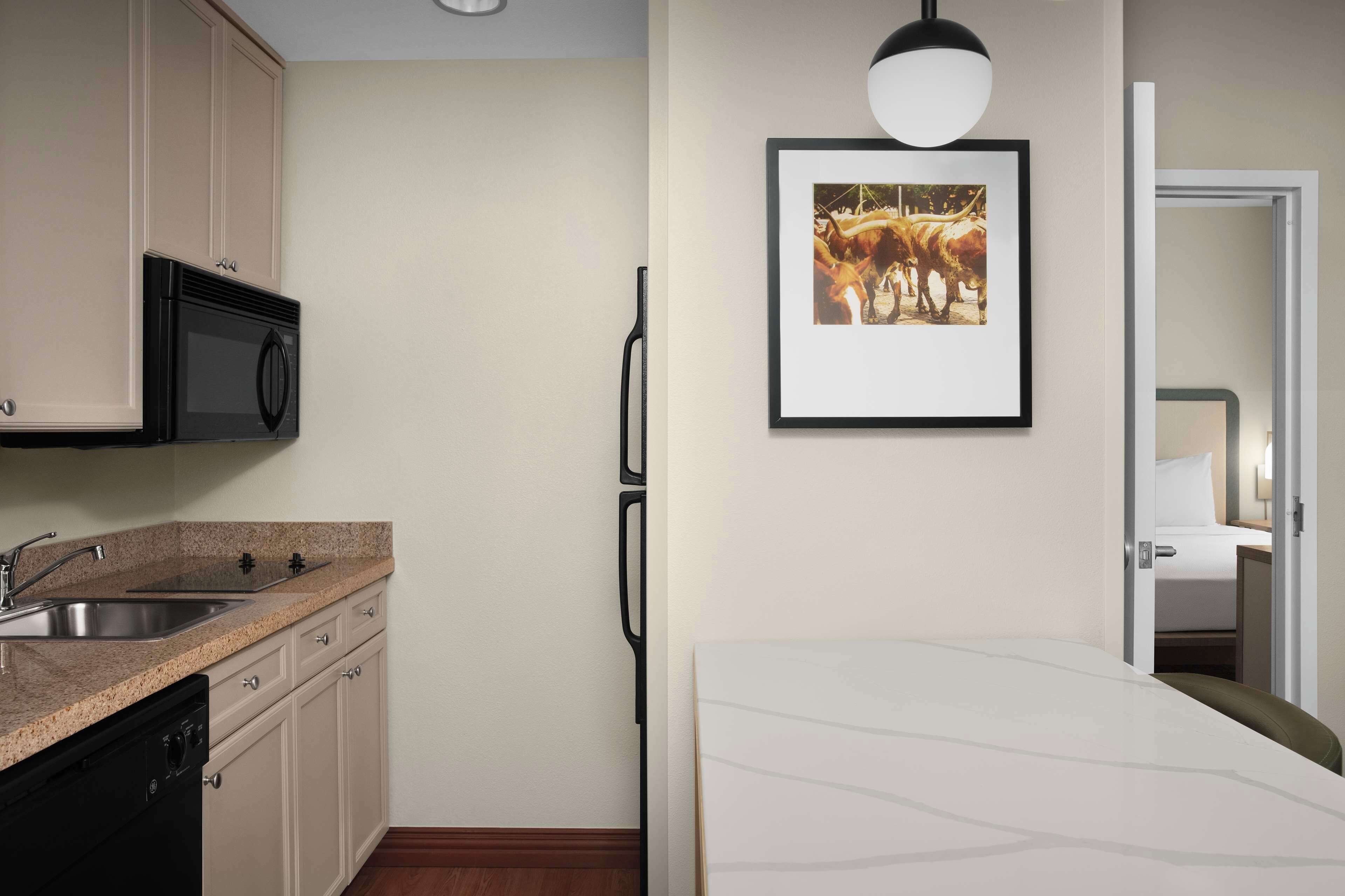 suite, 1 king bed, non smoking | private kitchen | full-sized fridge, microwave, stovetop, dishwasher