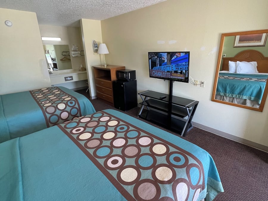 Standard Room, 2 Queen Beds, Non Smoking | Living area | TV