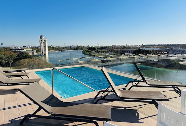 Seasonal outdoor pool, pool loungers