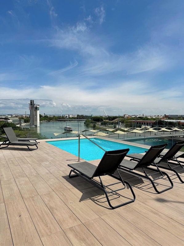 Seasonal outdoor pool, pool loungers