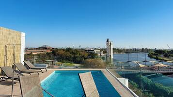 Seasonal outdoor pool, pool loungers