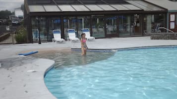 Indoor pool, seasonal outdoor pool, pool umbrellas, pool loungers