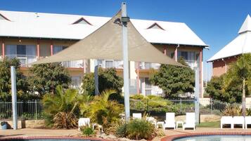 Outdoor pool, pool umbrellas, sun loungers