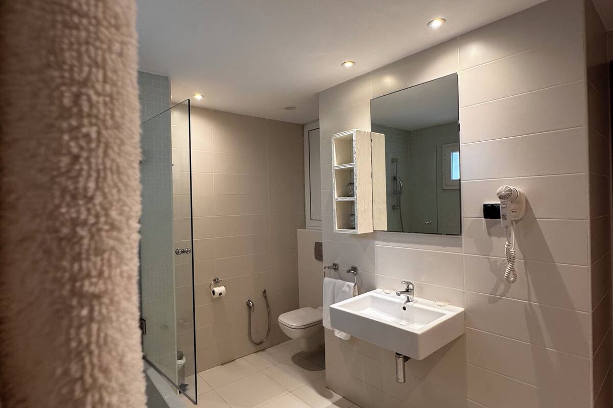 comfort room | bathroom | rainfall showerhead, free toiletries, hair dryer, slippers