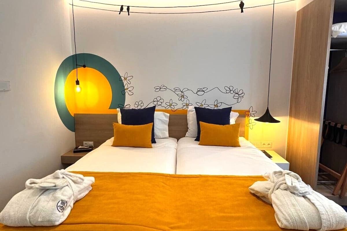 Habitación ejecutiva con 2 camas individuales | Ropa de cama de alta calidad y minibar