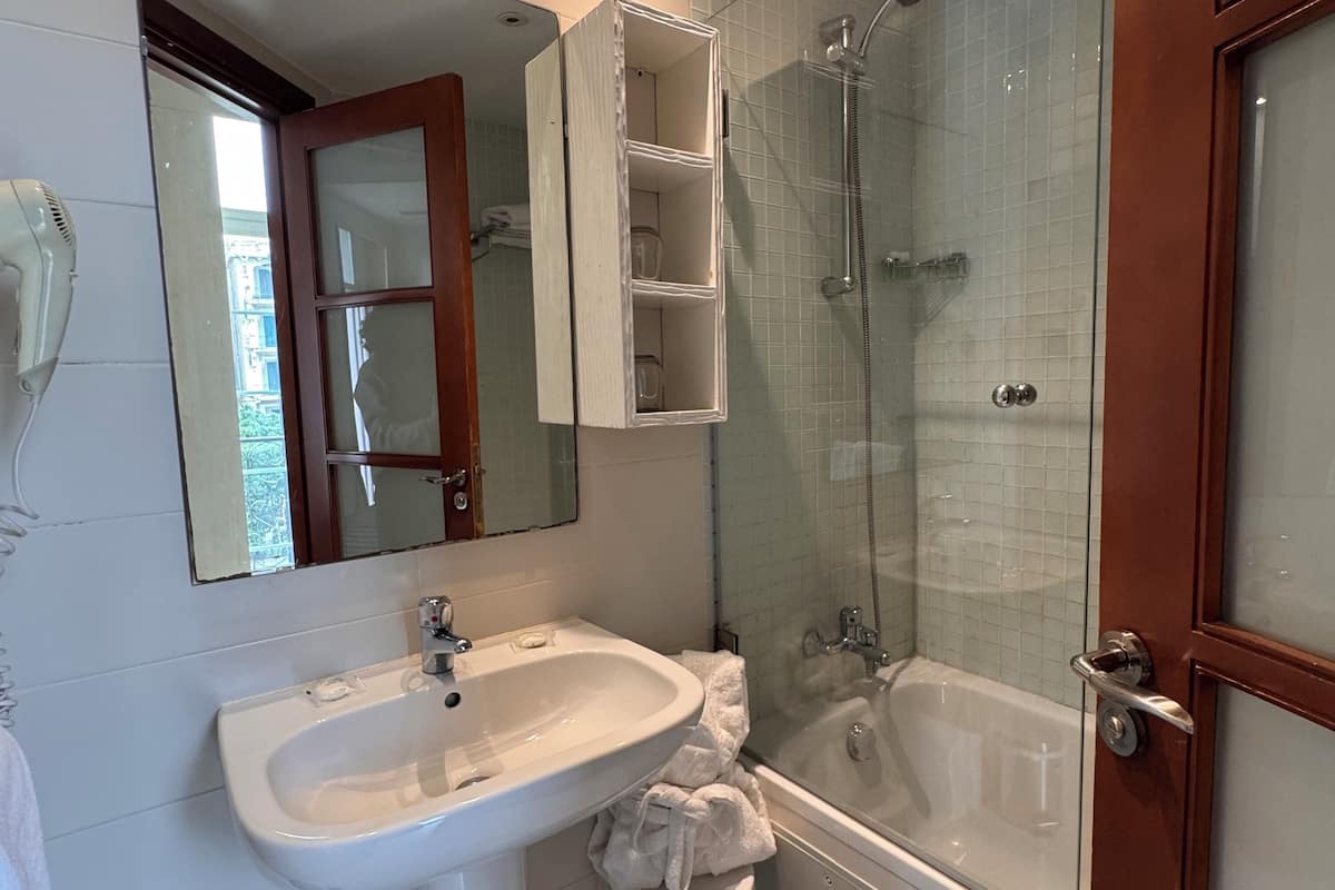 family room | bathroom | rainfall showerhead, free toiletries, hair dryer, slippers
