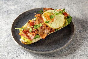 A sandwich on a dark plate. - Numa Prague Root (Prague)