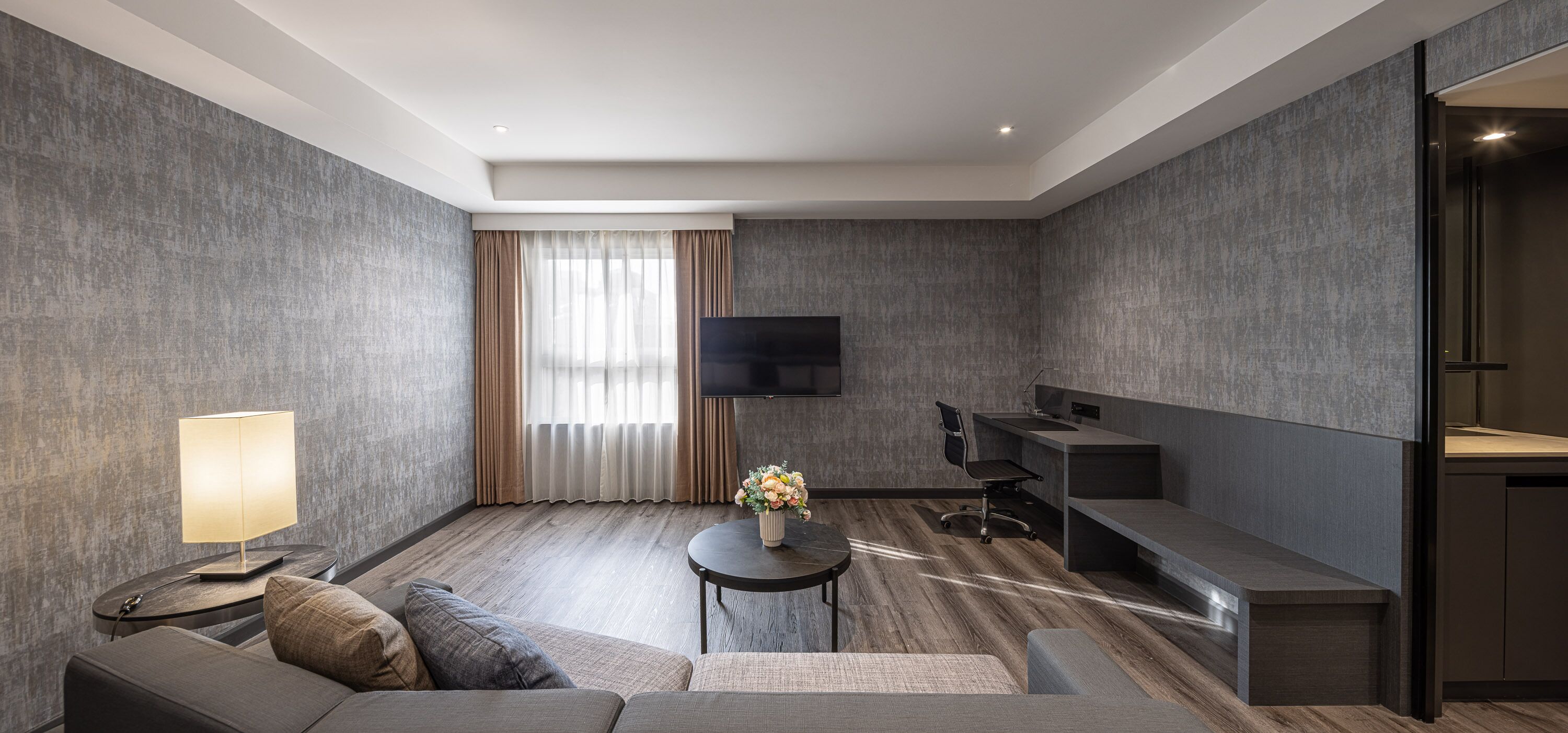 premier family room | minibar, in-room safe, desk, laptop workspace