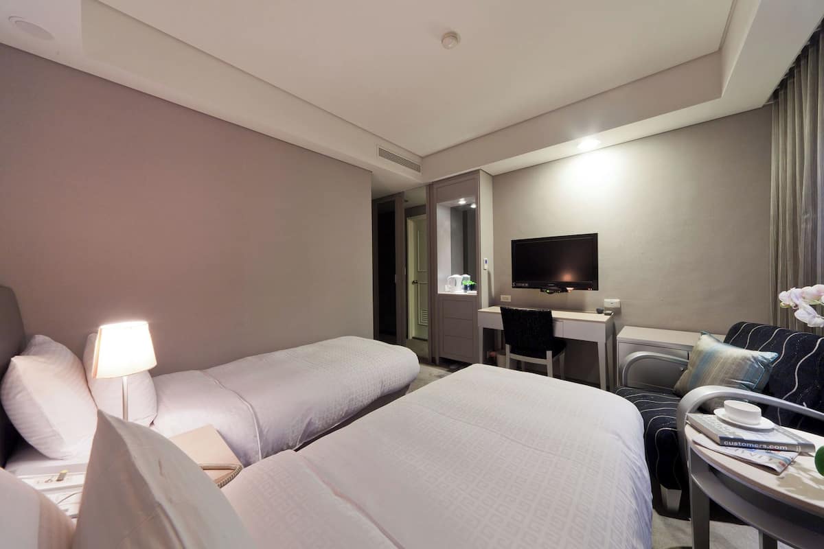 Superior Twin | 1 bedroom, down comforters, blackout drapes, free WiFi