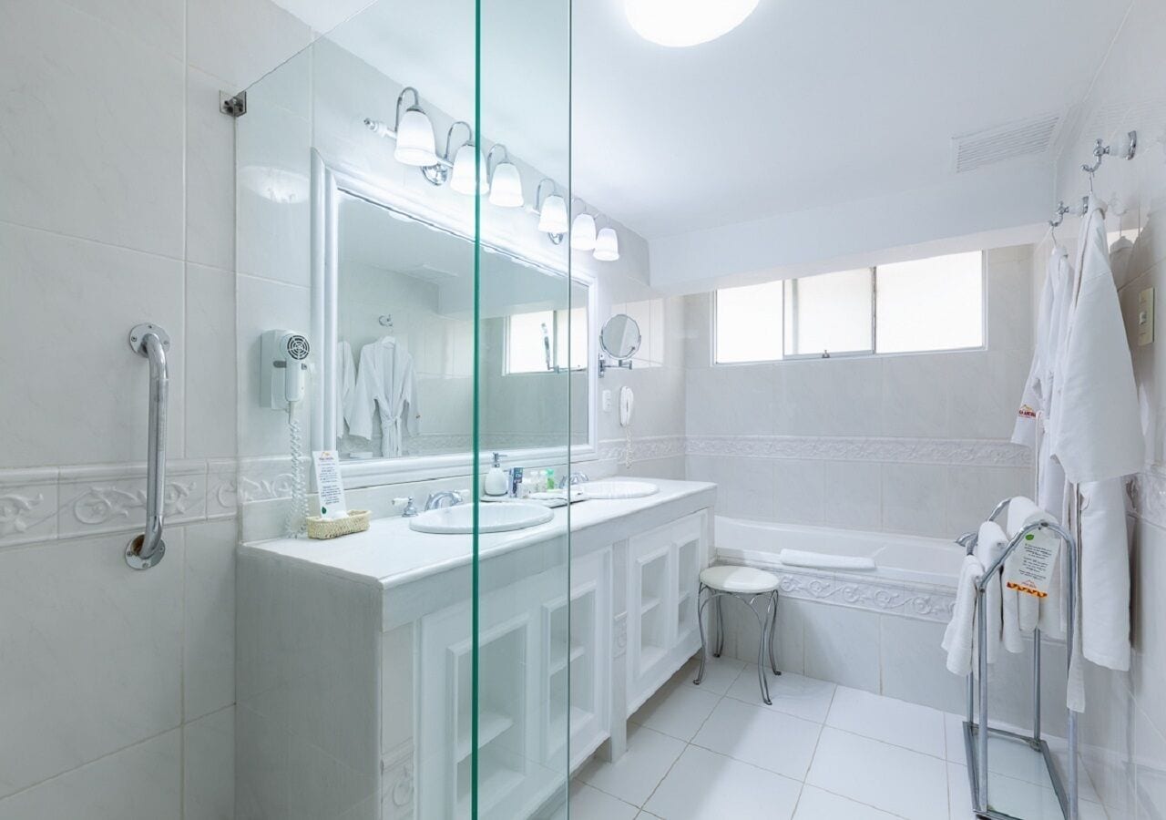 junior suite room with 1 king bed | bathroom | free toiletries, hair dryer, towels