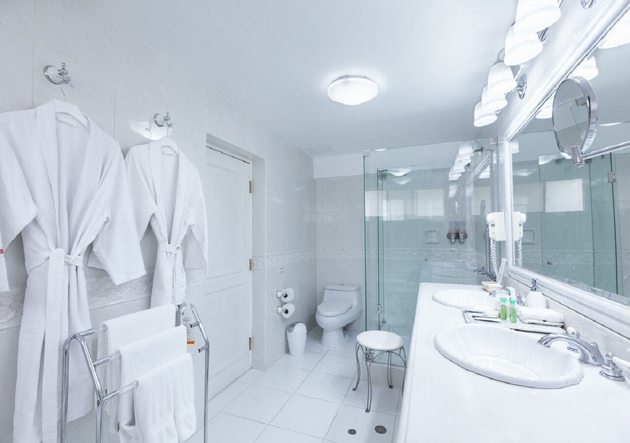 junior suite room with 1 king bed | bathroom | free toiletries, hair dryer, towels