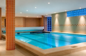 Indoor pool, open 9:00 AM to 10:00 PM, free cabanas, pool umbrellas