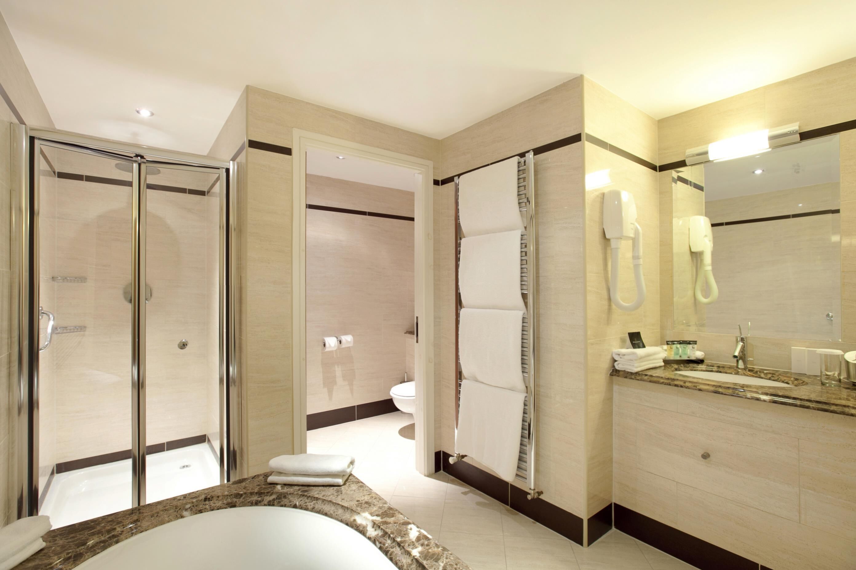 separate bathtub and shower, free toiletries, hair dryer, towels