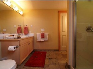 Separate bathtub and shower, designer toiletries, hair dryer, towels