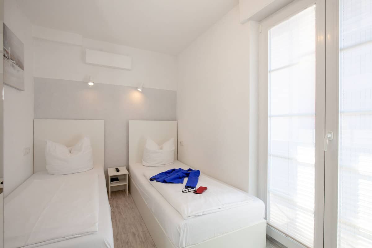 Economy Twin Room | Minibar, desk, free WiFi, bed sheets